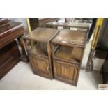 A pair of linen fold decorated bedside cupboards