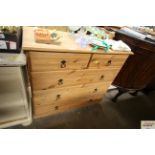 A modern pine chest fitted two short over three lo