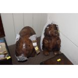 Two faux leather animal doorstops in the form of a