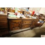 An oak sideboard fitted two central drawers flanke