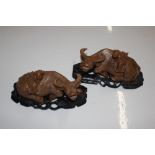 A pair of Oriental carved hardwood models of Buffa