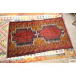 An approx. 4'5" x 2'7" Balouchi rug