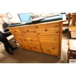 A pine multi drawer sideboard