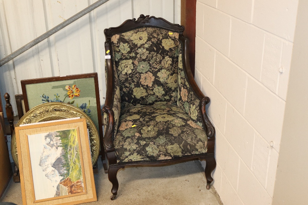 A Victorian wing back floral upholstered armchair