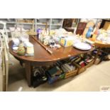 A Victorian mahogany extending dining table raised