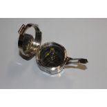 A reproduction silver plated compass