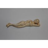 A carved bone figure of nude female