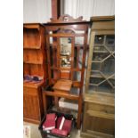 A mahogany mirrored back hall stand