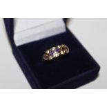 A 9ct gold cubic zirconia and amethyst set ring