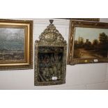 A brass embossed bevel edged wall mirror