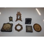 A box of miniature photo frames including silver e
