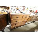 An oak chest fitted two short over three long draw