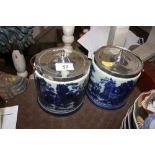 A pair of silver plated porcelain biscuit barrels