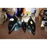 Three Poole pottery dolphins