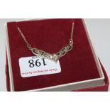 A boxed silver and white stone set necklace