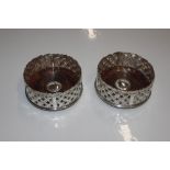 A pair of silver plated coasters