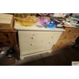 A cream painted pine chest fitted two short over t