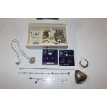 A box containing Sterling silver rings, ear-rings,