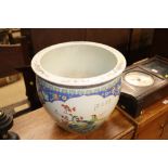 A large Chinese garden bowl with floral and bird d