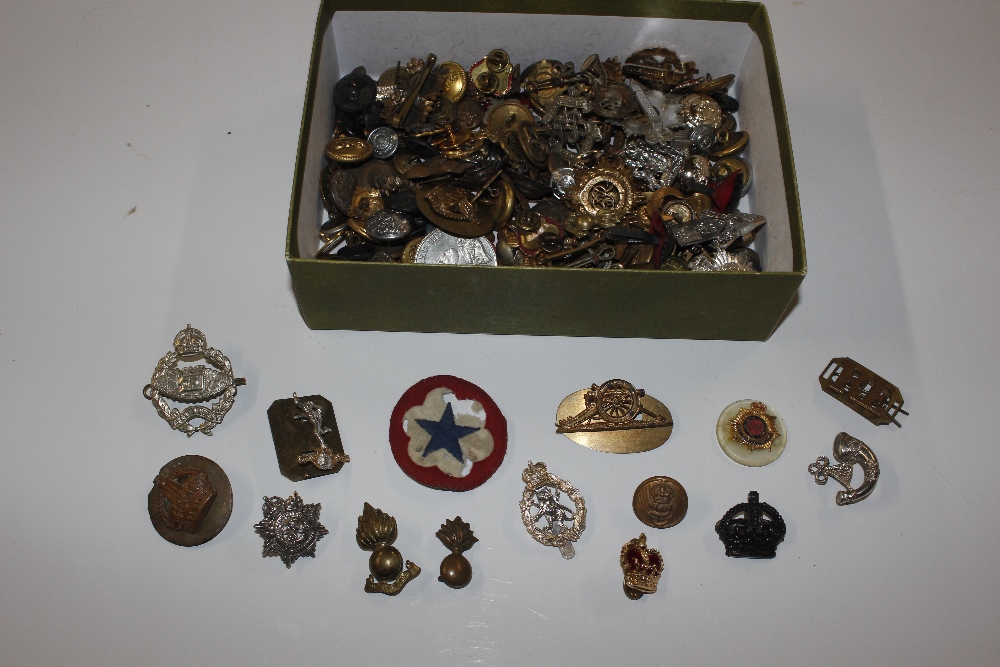 A box of badges and buttons