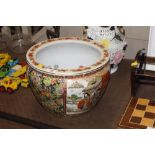 An Oriental fish and floral decorated jardiniere