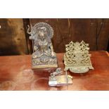 An Oriental metal ware figure of a seated Deity; a