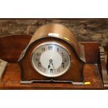 An oak cased chiming mantel clock