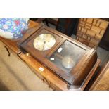 An mid-20th Century oak cased wall clock