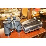 A pair of WW2 British Army binoculars in leather c