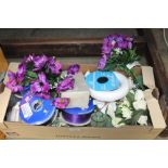 A box of artificial flowers and flower arranging a