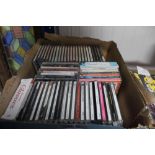 A box containing various CDs