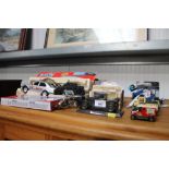 A collection of die cast model vehicles and a remo