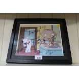 A framed Family Guy print bearing signatures