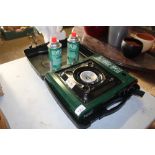 A Bright Spark camping stove and case with two spa