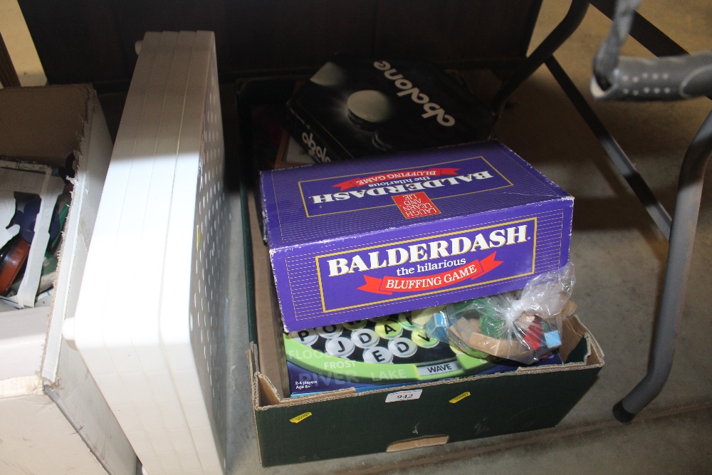 A box containing various board games etc.