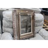 An ornate picture frame; an Oxford style frame and