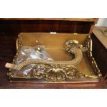 An ornate gilt and mirror decorated wall shelf wit