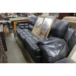 A black upholstered reclining three seater settee
