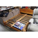 A pine double bed frame, approx. 142cm wide