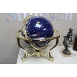 A polished hard stone decorated with world globe o