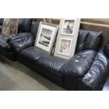 A black upholstered two seater settee