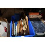 A box containing pictures and prints and various p