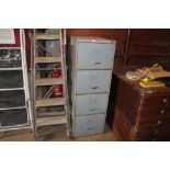 A metal four drawer filing cabinet