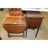 An oak drop leaf table and a sewing box