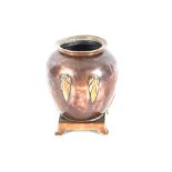 An Arts & Crafts style copper urn converted to a v