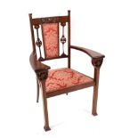 An Art Nouveau Liberty style carved mahogany three