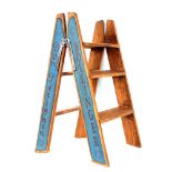 A reproduction wooden Champagne advertising ladder