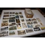 A box of various postcards