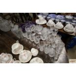A collection of cut glass table ware
