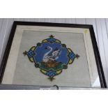 A framed bead work picture of a swan